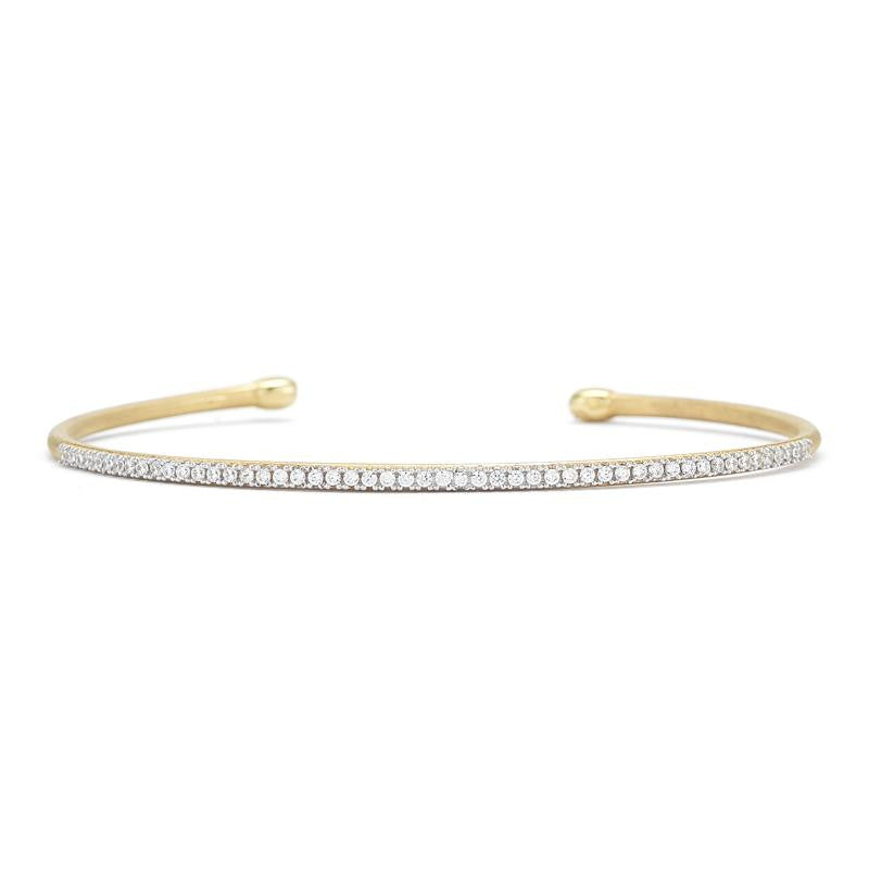 14KY BRUSHED-SATIN FINISHED TUBE BANGLE BRACELET, SET WITH 0.40 CARAT DIAMONDS.